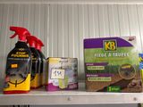 a shelf that has various household items on it