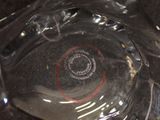 a close up of a glass plate with a red circle on it
