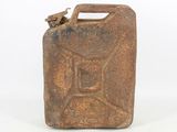 an old rusty metal jerry canister with a spout on the side
