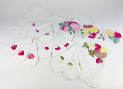 a bunch of bags with flowers on them on a table