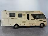a small motor home that is parked on the floor