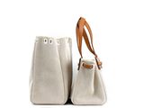 the two bags are sitting side by side on a white surface