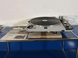 a record player sitting on top of a blue table