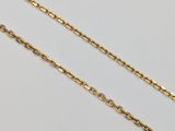 a pair of gold chains on a white background