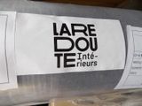 a roll of fabric that has a label on it