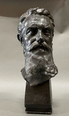 a statue of a man with a beard on a table