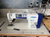 a sewing machine that is sitting on a table
