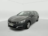 a grey car is parked in a white room