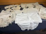 a table with a bunch of white laces on it
