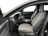 the interior of a car with the door open and the driver ' s seat up