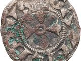 une vieille pièce de monnaie sur laquelle figure l'effigie d'un homme