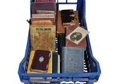 many books in a blue crate on a white background