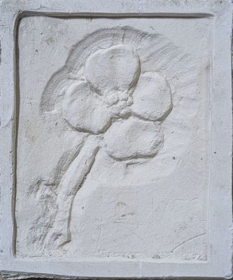 a picture of a flower on a wall in a building