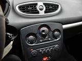 a car dashboard with buttons and a steering wheel