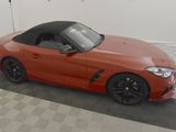 an image of a red sports car parked in a garage