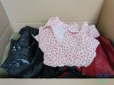 a box full of clothes that is sitting in the box