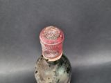 a bottle of wine that is sitting on a table