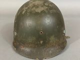a close up of a helmet on a white surface