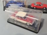 two toy cars in a clear box on a table