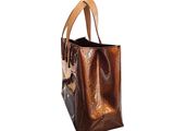 brown leather tote bag with floral design on the front