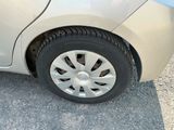 a close up of a car ' s tire on the road