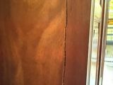 a crack in the wall of a bathroom that has been cleaned