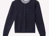 a close up of a black cardigan sweater on a white background