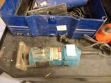 a blue tool box with a drill and other tools in it