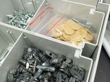 a box of screws and screws sitting on a table