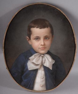 portrait of a young boy in a blue jacket and white bow tie