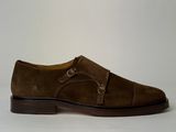 the shoe is brown sued and has a buckle on the side