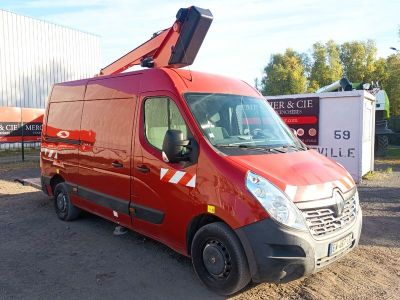 a red van that is parked in the dirt