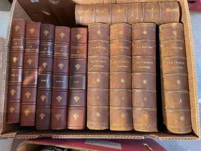 a box full of old books sitting on a table