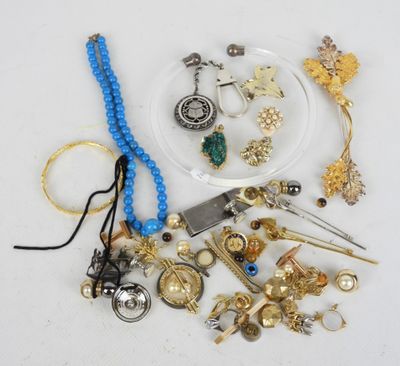 a lot of jewelry on a white surface