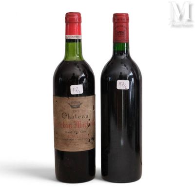 two bottles of wine sitting next to each other on a table