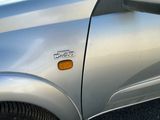 a close up of a car door with a sticker on it
