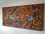 a picture of a painting hanging on the wall of a room