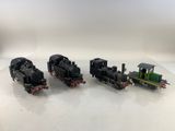 three toy trains on a white surface with a white background