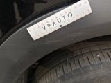 a close up of a sticker on a car ' s bumper