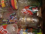 many different types of sodas and cans in this box
