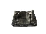 black leather handbag on white background with clipping for text