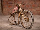 an old motorcycle that is sitting in the dirt