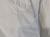 a bed with a white sheet on top of it