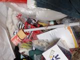 a pile of clothes and other items in a plastic bag