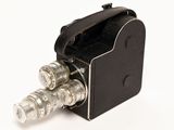 a black camera with four silver lenses in it