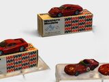 three toy cars sitting on display on a white surface