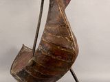 statue of a bird with a long neck and a long tail