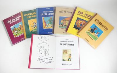several children ' s books are lined up on a white surface