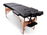 a black massage table on a white background
