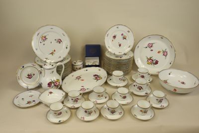 many different types of plates and bowls on the table
